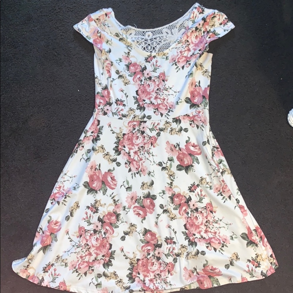 White dress with the flowers on it.